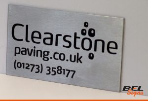 Engraved plaque with company logo and branding