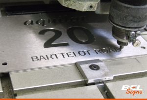 Our engraver at work | BEL Signs