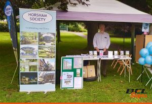 Horsham Society with roll-up banner at a local event