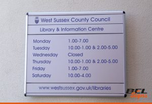 Informative sign with opening times and website details