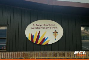 Printed and oval shaped sign for local primary school