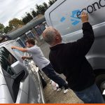 Our install team working on van graphics on-site | BEL