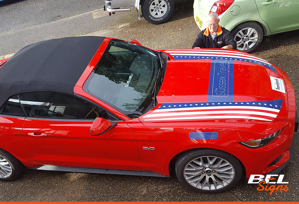 Mustang with american flag and logo for travel event in Horsham | The Sussex Travel Company